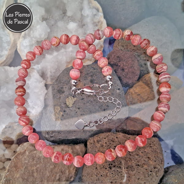 Réalisation d'un Collier en Rhodochrosite Rose d'Argentine 3A Boules de 8 mm de 44 cm + 4 cm sur de la pierre de lave